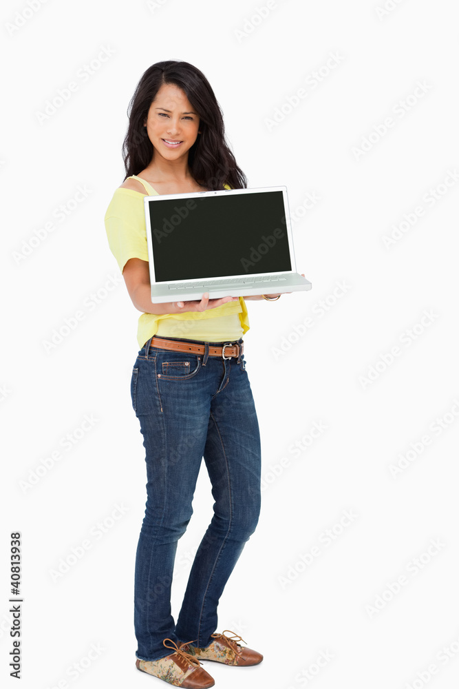 Beautiful Latin student showing a laptop screen Beautiful Latin student showing a laptop screen