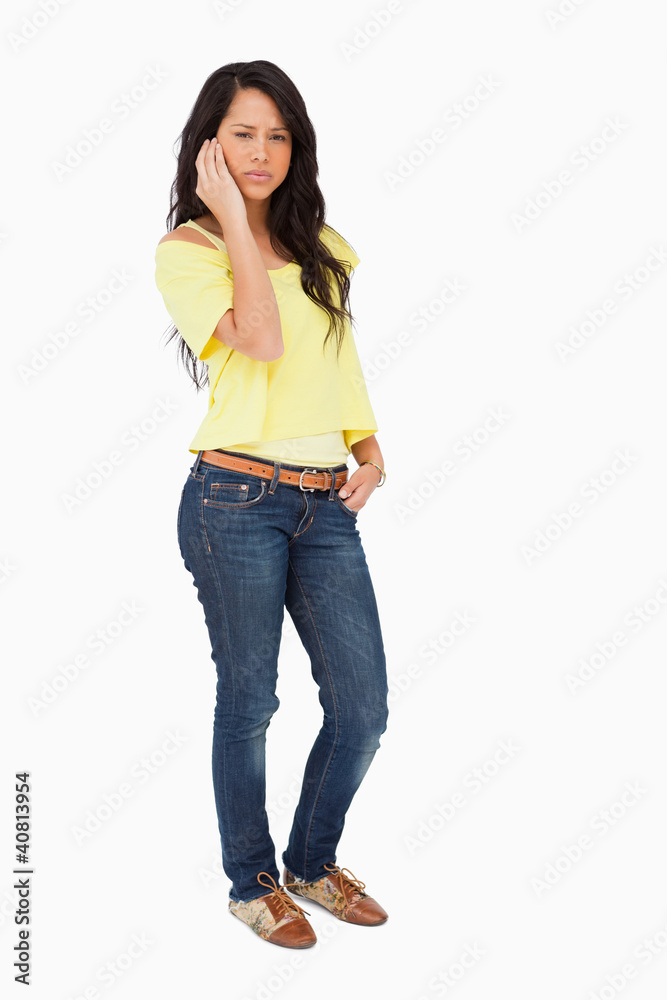 Portrait of a beautiful Latin frowning student on the phone Portrait of a beautiful Latin frowning student on the phone