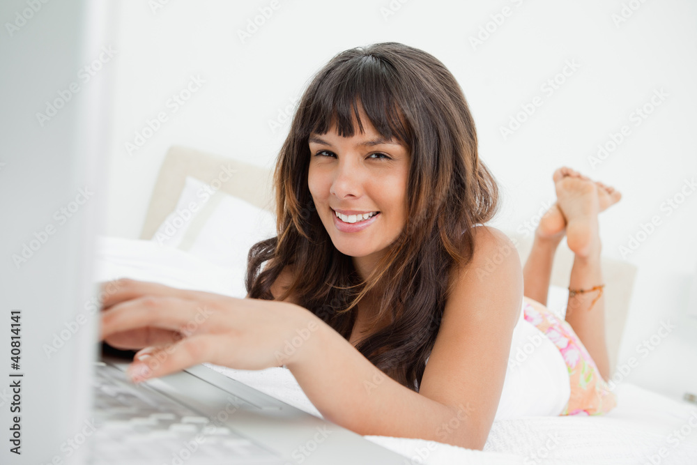 Portrait of a young woman chatting on a laptop Portrait of a young woman chatting on a laptop
