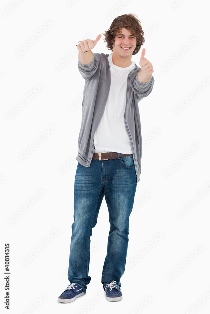 Happy male student posing the thumbs-up Happy male student posing the thumbs-up