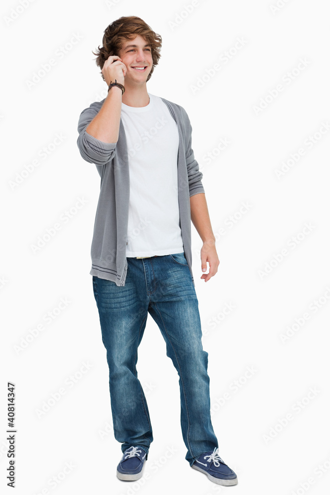 Smiling male student on the phone Smiling male student on the phone