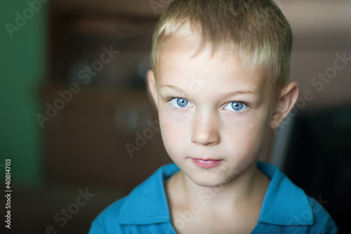 portrait of cute kid with blue eyes