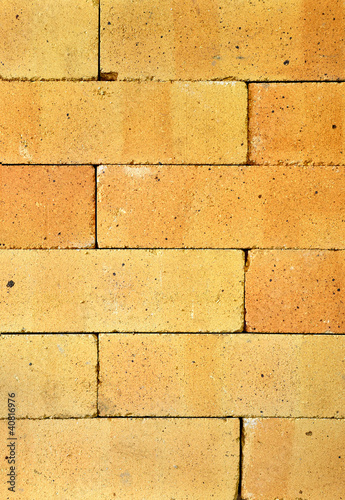 orange brickwall of antifire bricks close-up photo