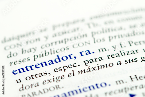Closeup of Spanish dictionary word for coach