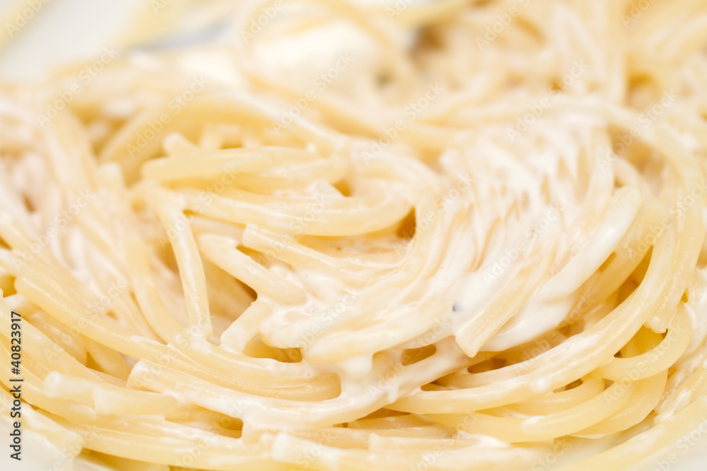 Freshly cooked spagetti pasta with sour cream - ready to eat Freshly cooked spagetti pasta with sour cream - ready to eat