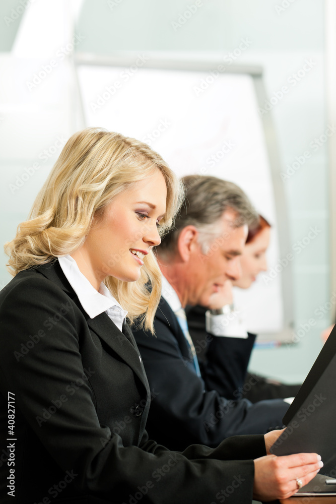 Business people - working in a workshop Business people - working in a workshop