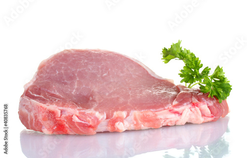 sliced raw pork steak with parsley isolated on white