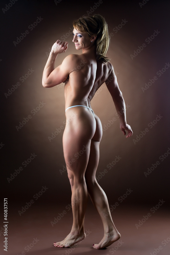 strong woman body builder walk side