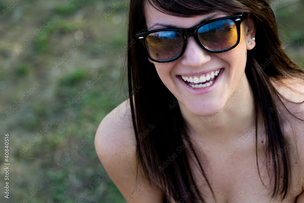 Beautiful smiling girl with sunglasses