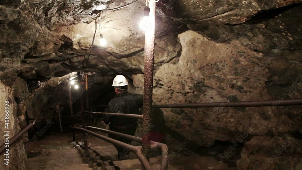 Man descending in mine Man descending in mine