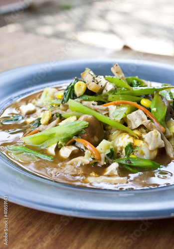 vegetarian thai food : stired noodle in creamy gravy sauce photo