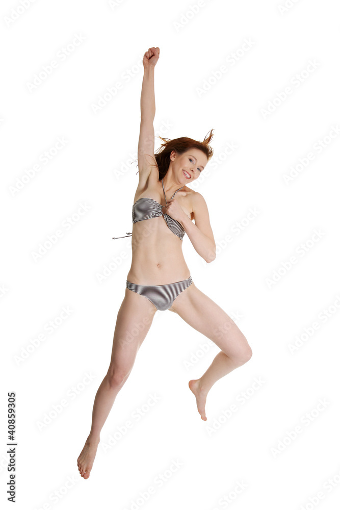 Happy summer woman in bikini jumping