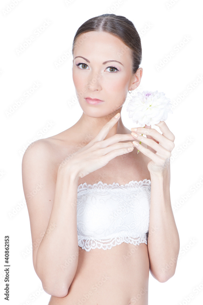 Young beautiful woman holding flower in her hands Young beautiful woman holding flower in her hands