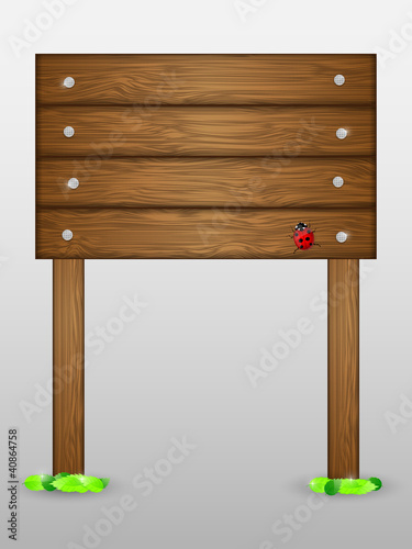 Wooden signboard with ladybird.