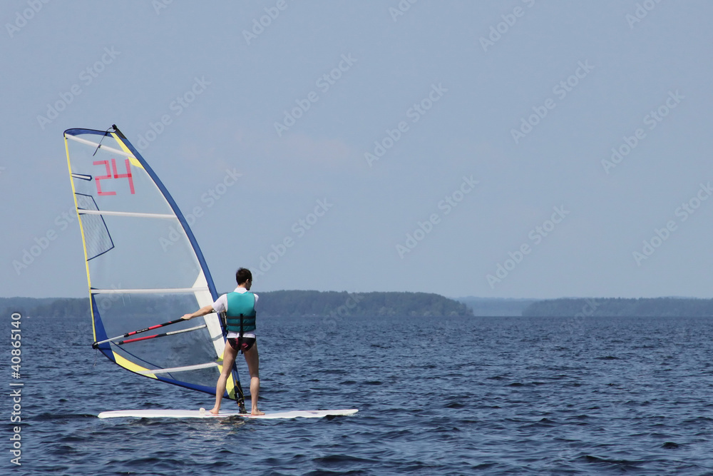 Naklejka premium Surfer on regatta