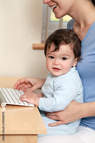 Baby and mother using computer