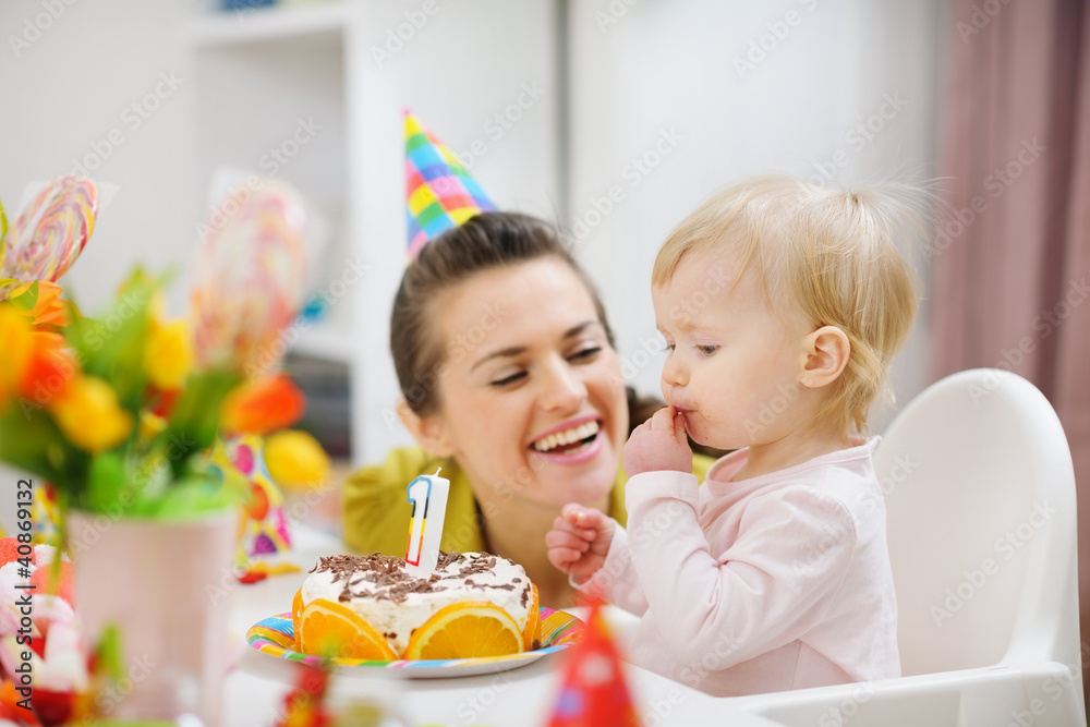 Mother spending fun time with baby on birthday party Mother spending fun time with baby on birthday party