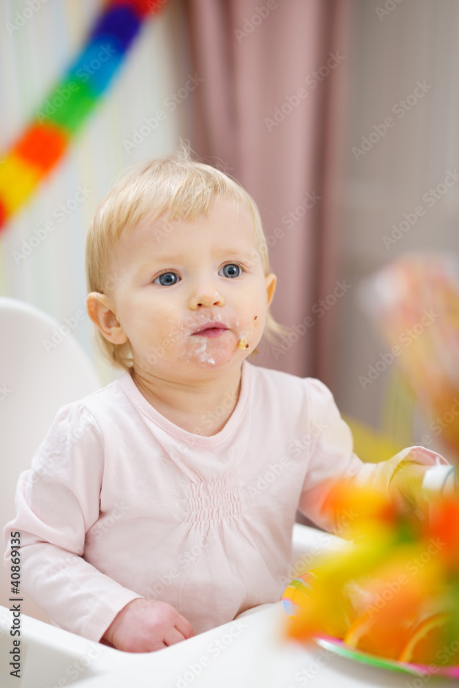 Portrait of thoughtful baby sitting at table Portrait of thoughtful baby sitting at table