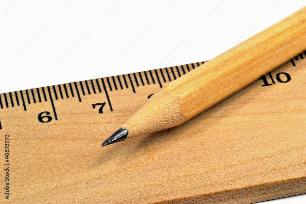 Macro image wooden pencil and ruler on white background Macro image wooden pencil and ruler on white background