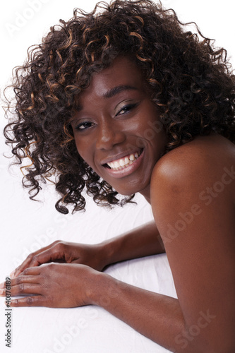 Smiling African American Woman Reclining on Floor