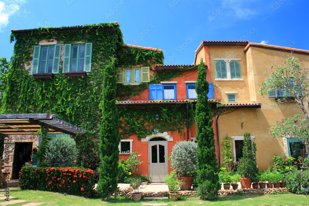 italy style building in beautiful garden and blue sky