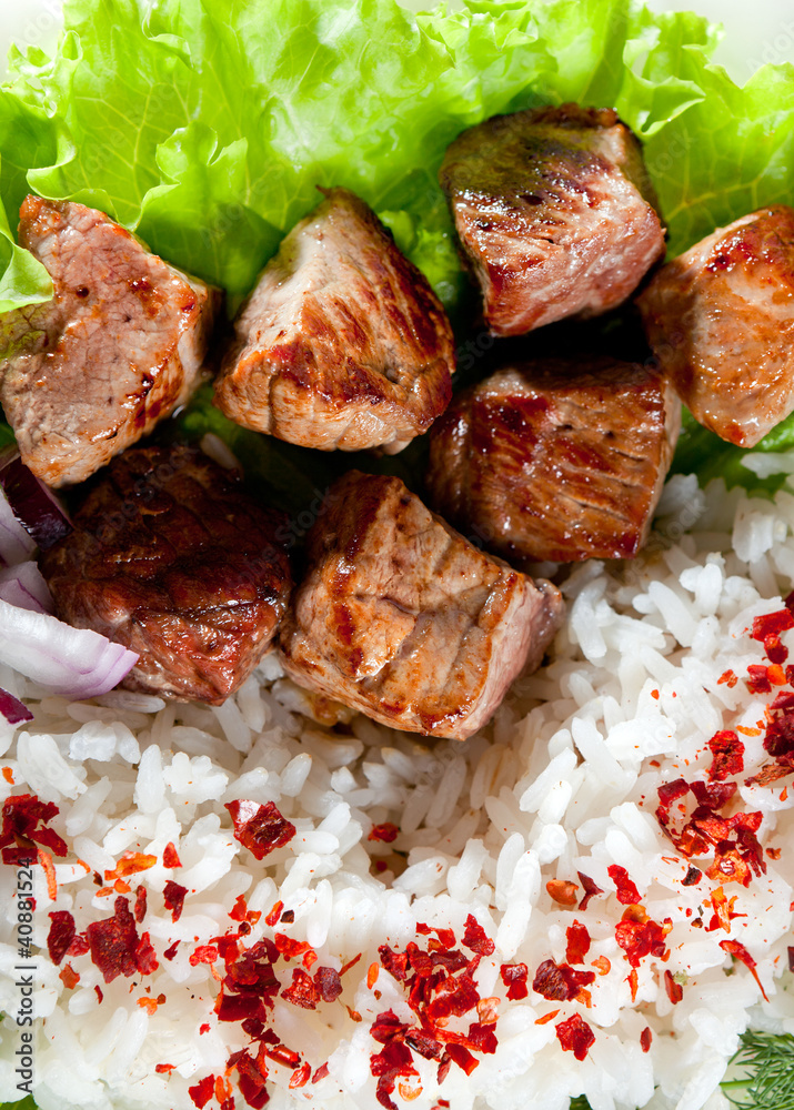 fried meat with rice and vegetables fried meat with rice and vegetables