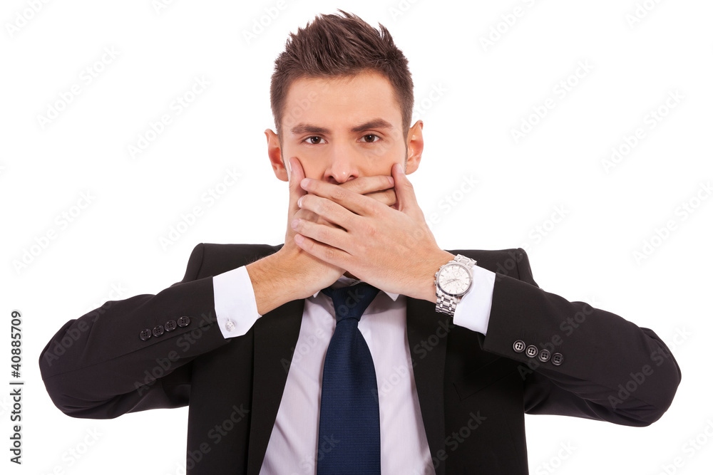 business man making the speak no evil gesture business man making the speak no evil gesture