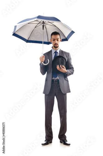 Businessman with umbrella on white © Elnur