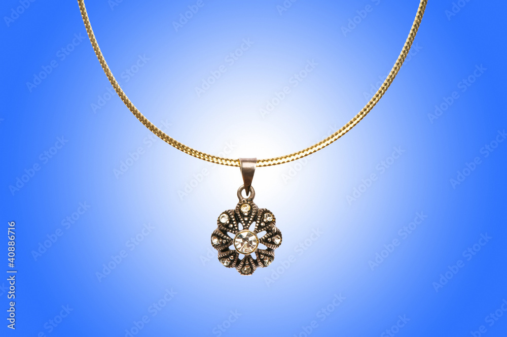 Fototapeta premium Golden jewellery against gradient background