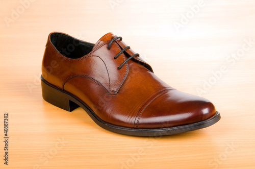 Brown shoes on wooden table