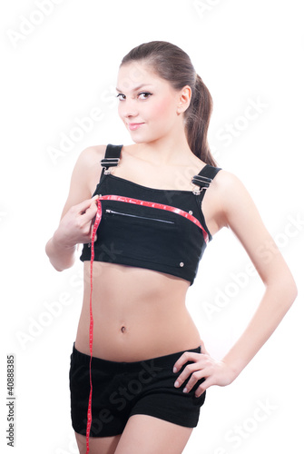 Young woman with measure tape around breast © stormy