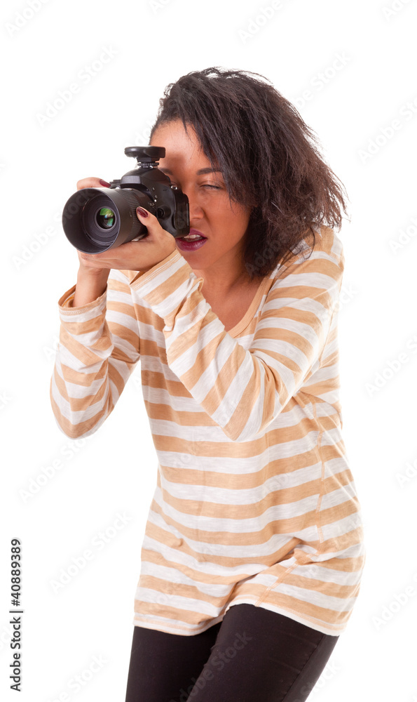 attractive dark skinned girl with a camera on a white background attractive dark skinned girl with a camera on a white background