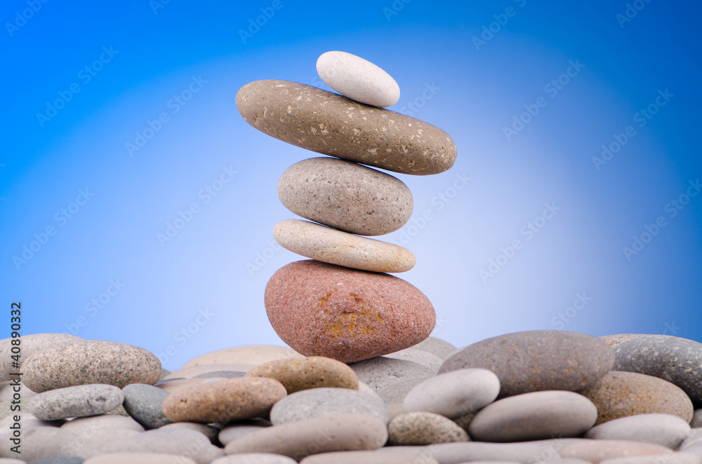Pebbles stack against gradient background Pebbles stack against gradient background