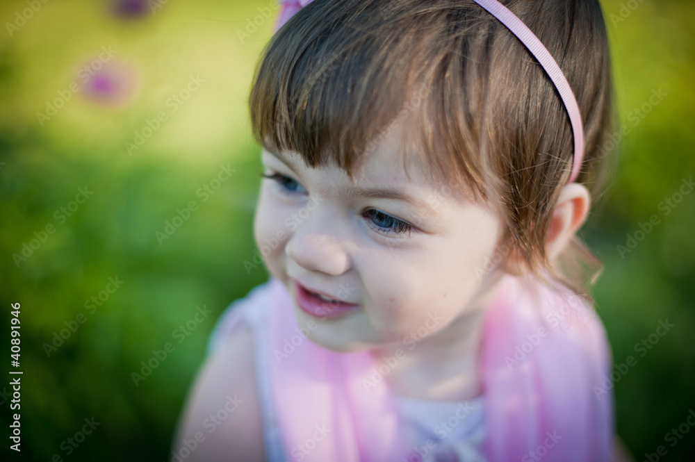 A little girl in a summer park A little girl in a summer park