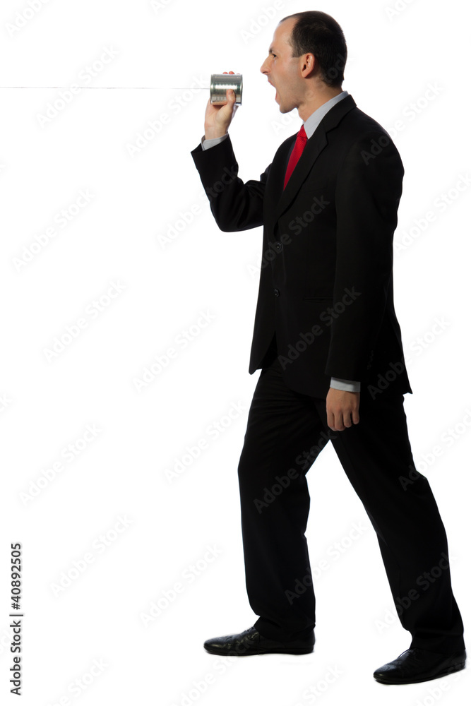 Businessman yelling through an oldschool can phone Businessman yelling through an oldschool can phone