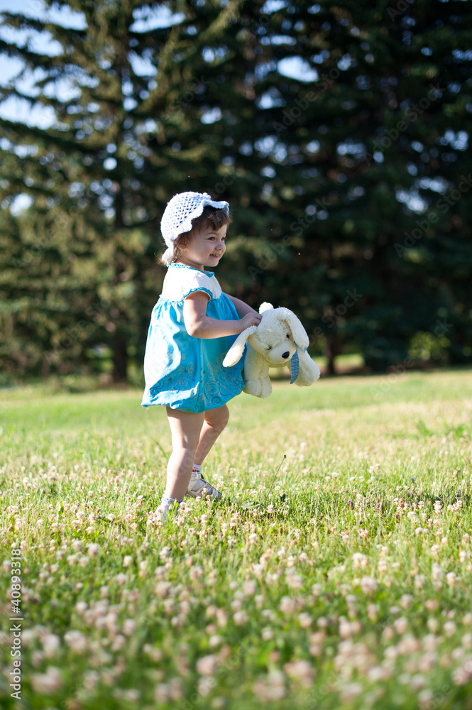 A little girl in a summer park