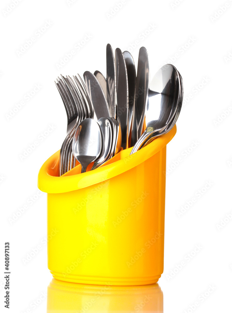 Kitchen cutlery, knives, forks and spoons in yellow stand Kitchen cutlery, knives, forks and spoons in yellow stand