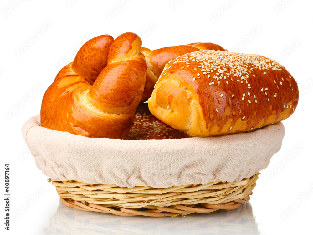 Baked bread in basket isolated on white