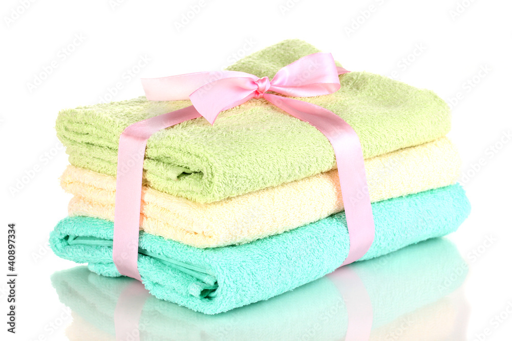 Colorful towels with ribbon isolated on white Colorful towels with ribbon isolated on white