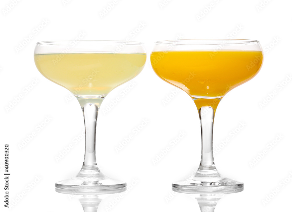 Tropical juices in glasses isolated on white Tropical juices in glasses isolated on white