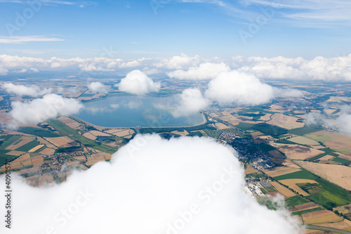 Fotografie aerial view of village landscape over clouds