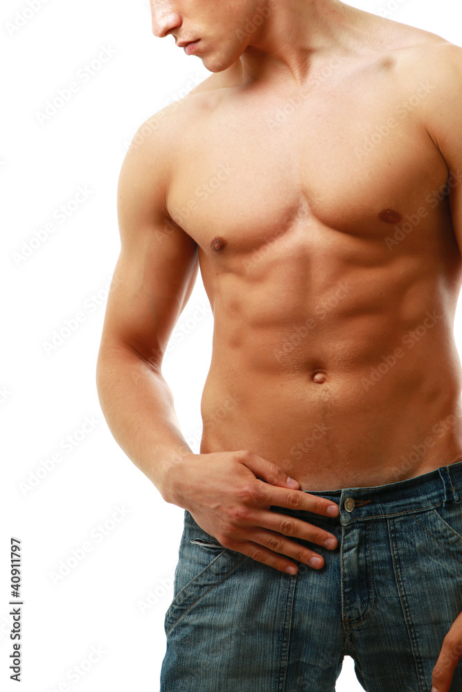 Healthy muscular man posing over white background
