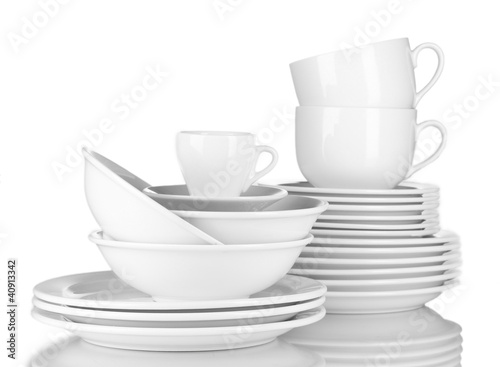 empty bowls, plates and cups on gray background