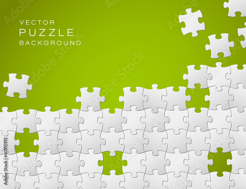 Vector green background made from white puzzle pieces