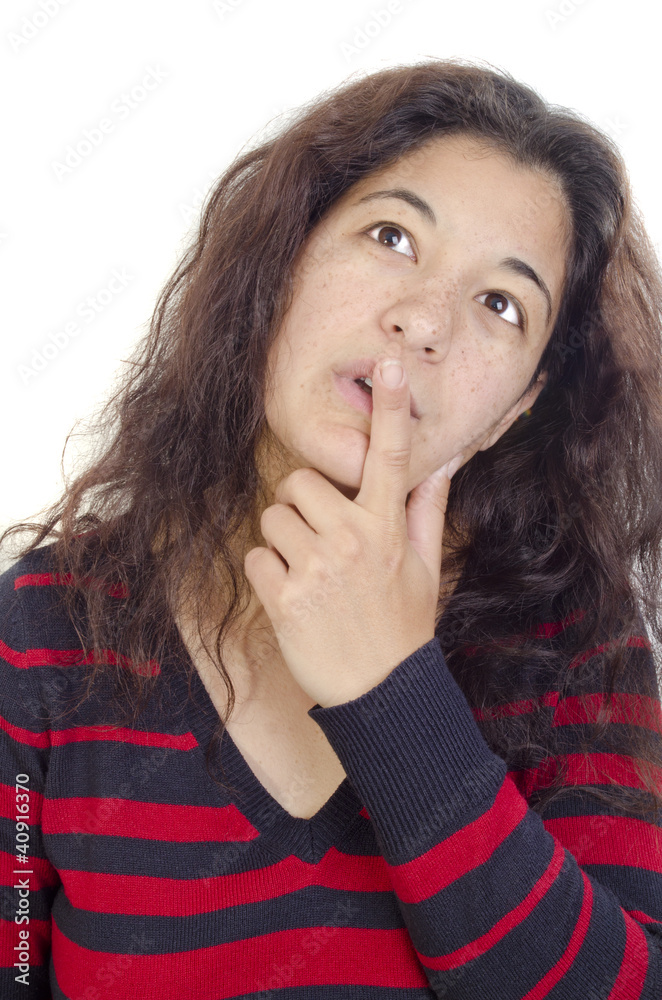 thoughtful young woman and the index finger on her lips thoughtful young woman and the index finger on her lips