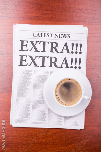 The newspaper EXTRA! EXTRA! and coffee