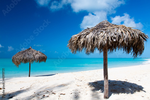 Beach Umbrella on a perfect white beach in front of Sea © Cristian Santinon