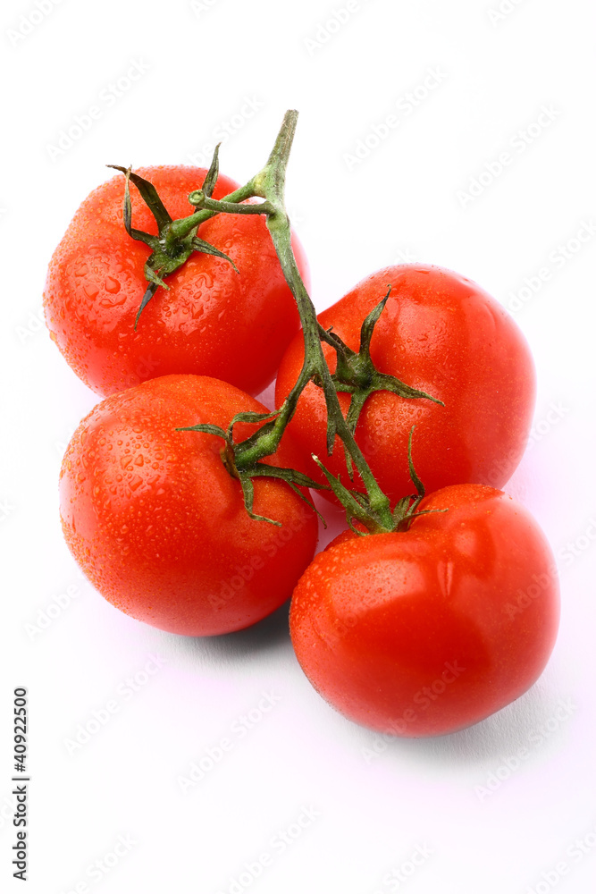 Bunch of delicious fresh tomatoes isolated on white background Bunch of delicious fresh tomatoes isolated on white background