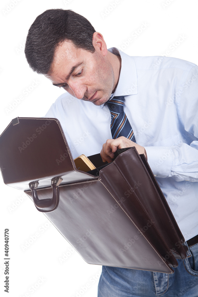 man holding a briefcase and putting documents inside