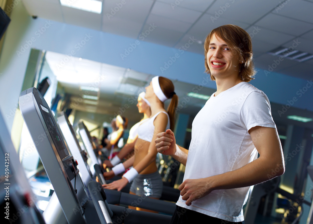 Fototapeta premium Young man doing sport in gym